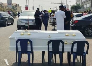 Angry Contractors Lay Coffin In Front Of Ministry Of Finance In Protest